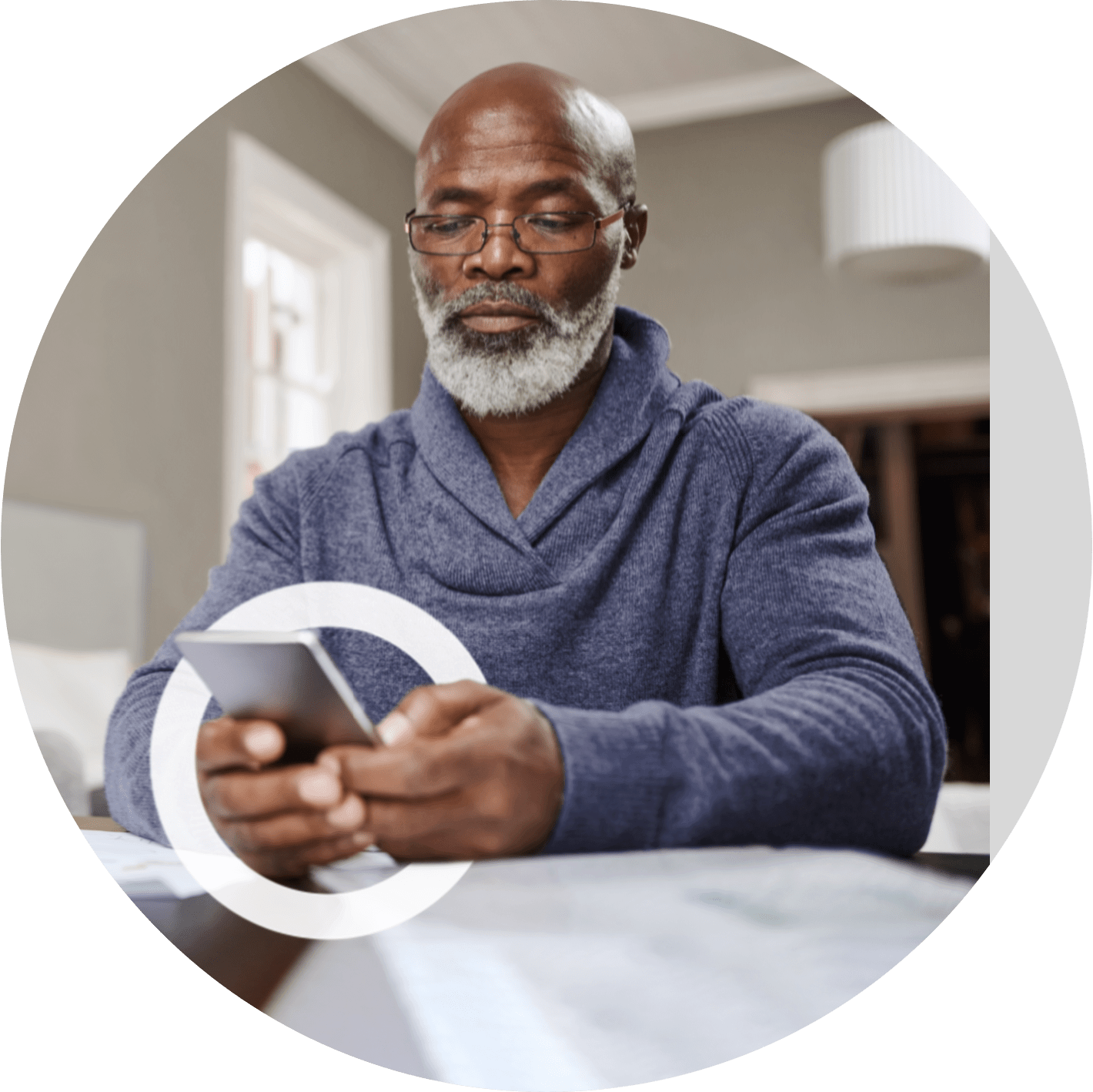 A man texting on his phone depicts that loss of hand strength might be a sign of MMN.