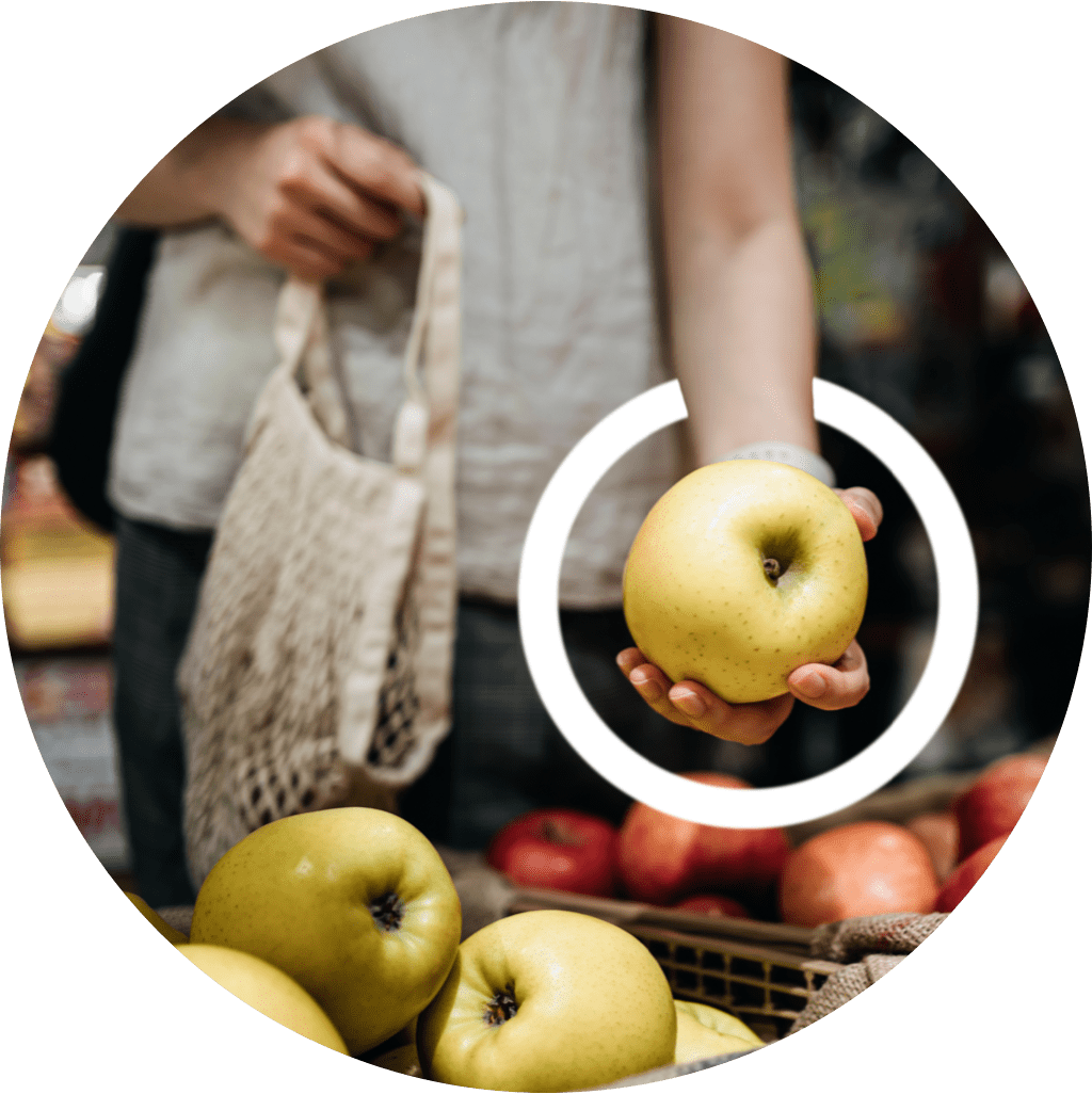 A woman holding an apple depicts how difficult it can be to hold on to things with MMN.