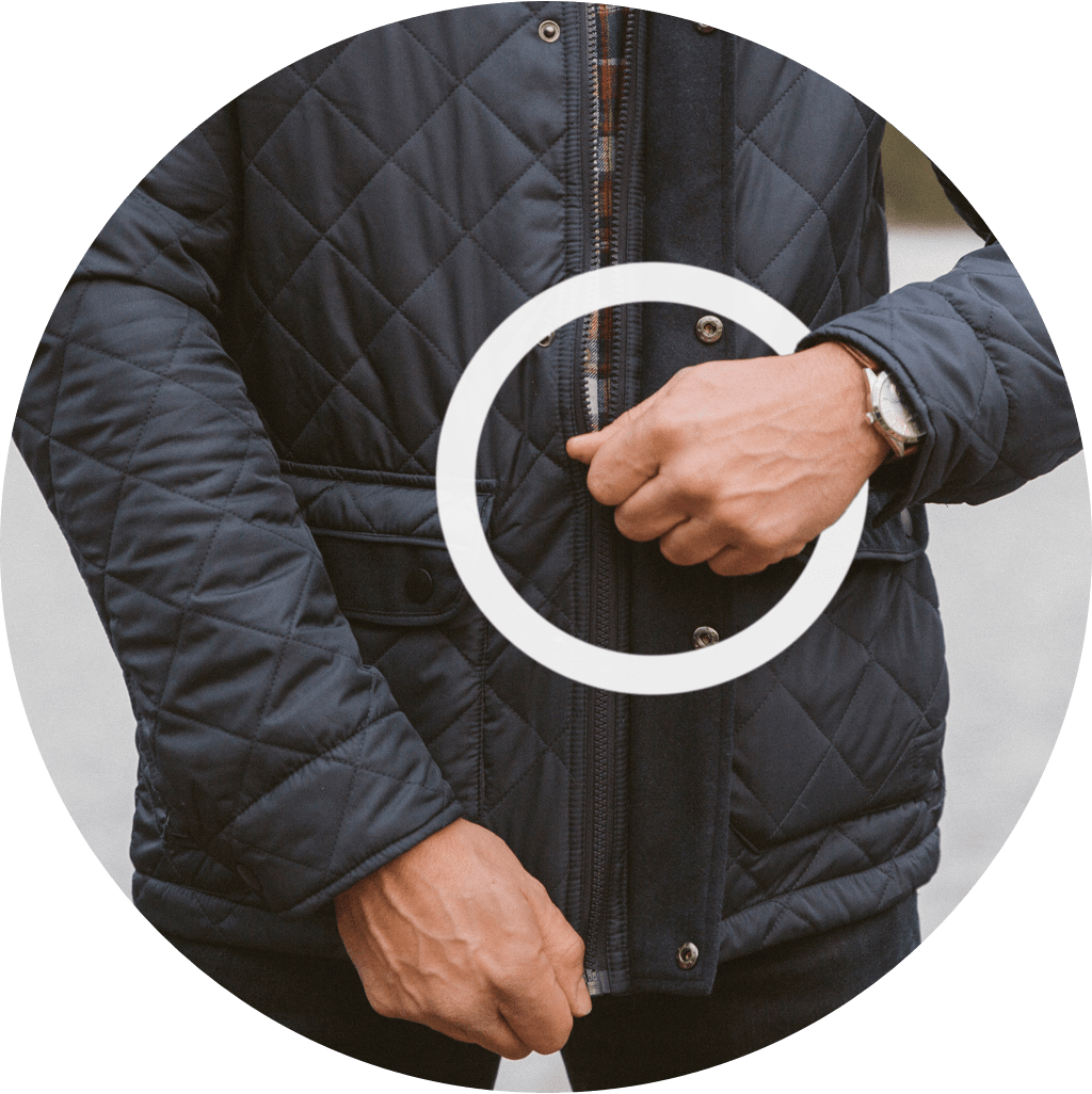 A man zipping his jacket depicts how difficult it can be if you have MMN.