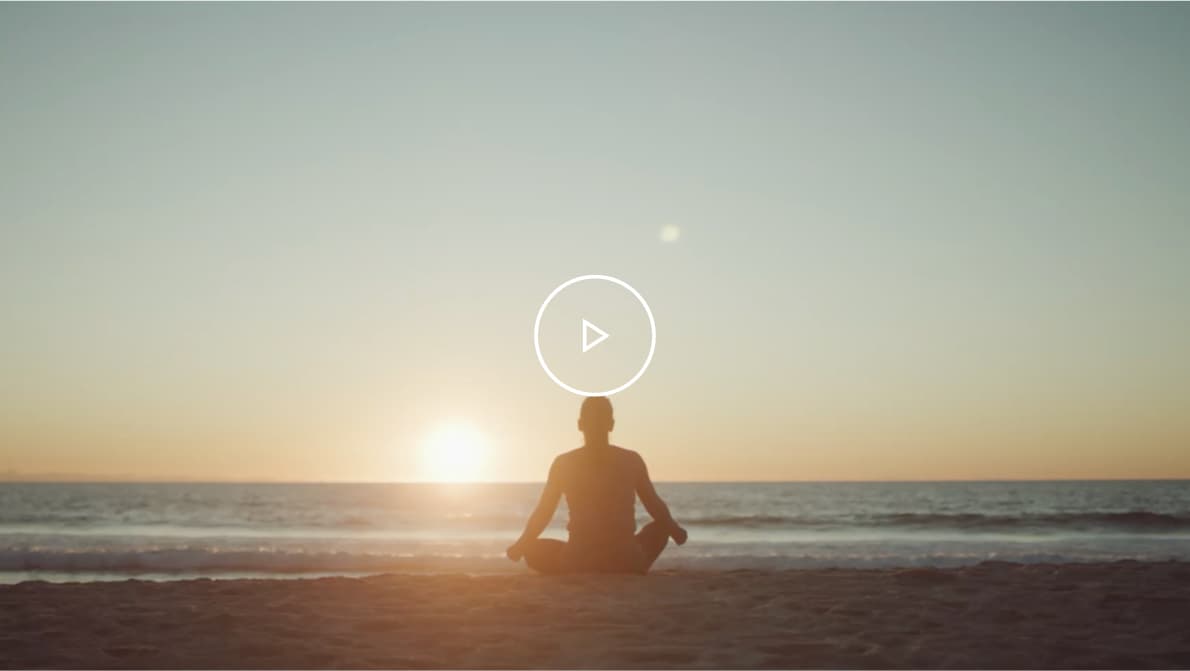 Thumbnail video of Jen, an MMN patient, doing yoga on the beach.