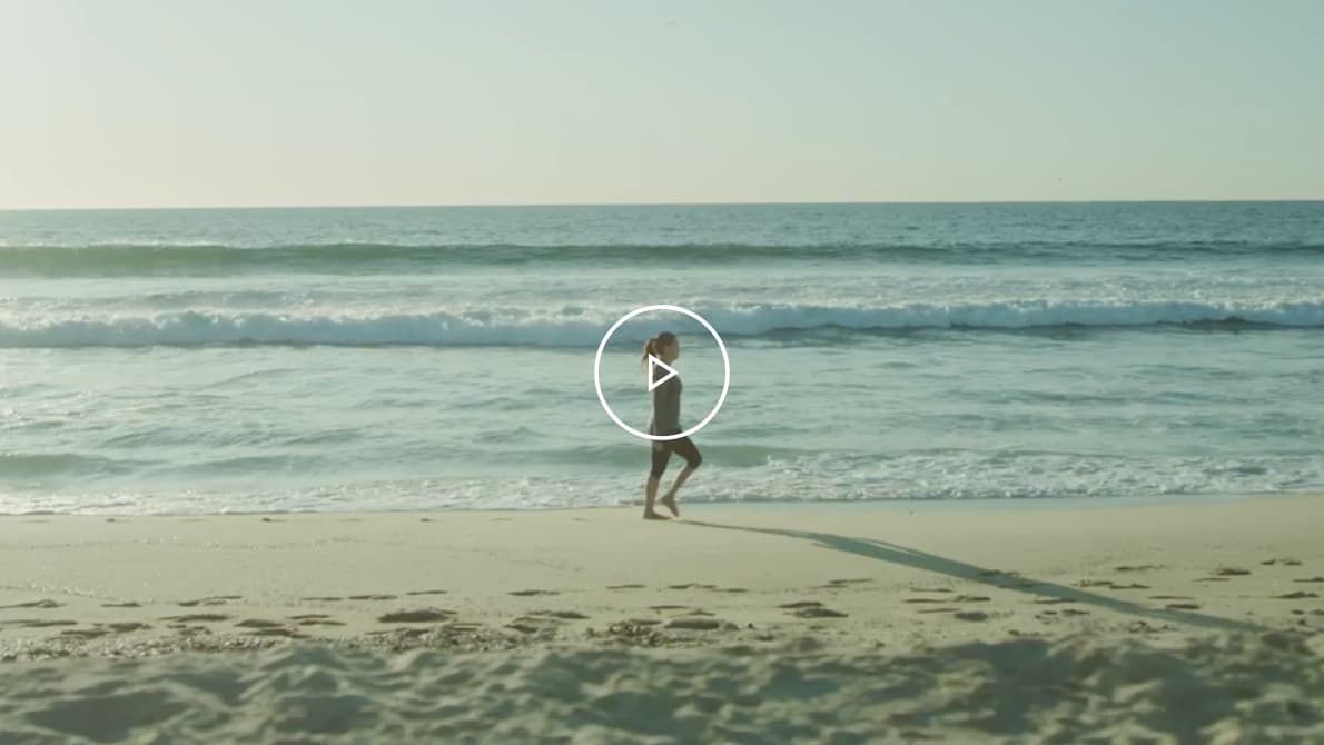 A video thumbnail of Jen, a MMN patient walking on the beach.